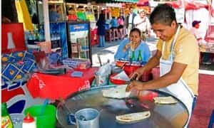 Food vendor making quesadillas in Mexico City Mexico insurance online with MexicanInsuranceStore.com