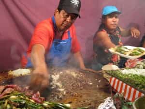Street taco stand with fresh cilantro and mystery meat in Mexico Mexican insurance for cars with MexicanInsuranceStore.com